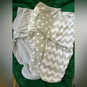 Set of 3 velcro swaddles. Two are comfy cubs brand and the grey is Aden + Anais